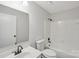 This bathroom offers a tub and shower combination with a clean, white aesthetic at 6501 Thamesmead Ln, Mint Hill, NC 28227