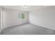 Neutral bedroom with fresh paint and a window with natural light at 6501 Thamesmead Ln, Mint Hill, NC 28227