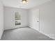 Cozy bedroom with neutral carpet, natural light and fresh paint at 6501 Thamesmead Ln, Mint Hill, NC 28227