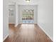 Dining area with hardwood floors and natural light, leading to an outdoor patio at 6501 Thamesmead Ln, Mint Hill, NC 28227