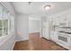 Bright kitchen area with white cabinets, new appliances, and ample natural light at 6501 Thamesmead Ln, Mint Hill, NC 28227