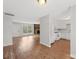 Open layout showcasing the kitchen with white appliances adjacent to a well-lit living space at 6501 Thamesmead Ln, Mint Hill, NC 28227