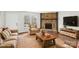 Inviting living room with a stone fireplace and stylish decor, creating a warm and cozy atmosphere at 6501 Thamesmead Ln, Mint Hill, NC 28227