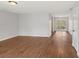 Spacious living room with natural light, hardwood flooring and access to outdoor patio at 6501 Thamesmead Ln, Mint Hill, NC 28227