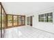 Sunroom with white walls, light tile flooring, and sliding door access to the outdoors at 6501 Thamesmead Ln, Mint Hill, NC 28227