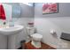 Charming powder room with pedestal sink, wainscoting, and modern fixtures at 7426 Calhoun Falls Dr, Rock Hill, SC 29732