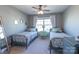 Cozy bedroom featuring twin beds, soft carpeting, and a window for natural light at 7426 Calhoun Falls Dr, Rock Hill, SC 29732