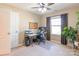 Bedroom featuring a ceiling fan, a desk, and a window that allows natural light to illuminate the room at 7426 Calhoun Falls Dr, Rock Hill, SC 29732