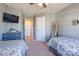 Cozy bedroom featuring two twin beds, a TV, and neutral decor, providing a comfortable and inviting space at 7426 Calhoun Falls Dr, Rock Hill, SC 29732