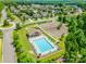 Aerial view of a community pool with lounge chairs in a neighborhood surrounded by green trees at 7426 Calhoun Falls Dr, Rock Hill, SC 29732