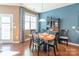 Inviting dining room with ample natural light, hardwood floors, and a stylish dining set at 7426 Calhoun Falls Dr, Rock Hill, SC 29732