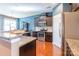 Modern kitchen with stainless steel appliances, dark cabinets, and granite countertops, perfect for cooking at 7426 Calhoun Falls Dr, Rock Hill, SC 29732