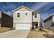 Charming two-story home with a two-car garage and covered entryway at 816 Blue Canyon Dr, York, SC 29745