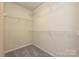 Carpeted walk-in closet with wire shelving for organized storage at 816 Blue Canyon Dr, York, SC 29745