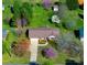 Aerial shot showcasing a home with an attached garage, concrete driveway, and beautiful yard with flowering trees at 841 E Zion Church Rd, Shelby, NC 28150