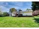 Exterior view of the house from the backyard, highlighting the deck and well-kept lawn at 841 E Zion Church Rd, Shelby, NC 28150
