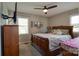 Cozy bedroom featuring a wooden bed frame, dresser, and TV on a wall mount at 841 E Zion Church Rd, Shelby, NC 28150