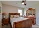 Bedroom with wooden bed and dresser, plus modern decor and natural lighting at 841 E Zion Church Rd, Shelby, NC 28150