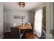 Dining room with floral curtains, a round table, and modern decor at 841 E Zion Church Rd, Shelby, NC 28150