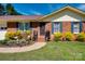 Charming brick home featuring a manicured lawn and walkway leading to the front door at 841 E Zion Church Rd, Shelby, NC 28150