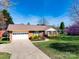 Lovely brick home with a charming front yard, long driveway, and attached garage at 841 E Zion Church Rd, Shelby, NC 28150