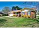 Brick home with attached garage, well-maintained lawn and landscaping for a cozy curb appeal at 841 E Zion Church Rd, Shelby, NC 28150