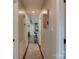 Hallway with art hanging on the wall leading into the kitchen area with bar stool seating at 841 E Zion Church Rd, Shelby, NC 28150