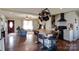 Open concept kitchen features a large island with bar stool seating and a pot rack hanging from the ceiling at 841 E Zion Church Rd, Shelby, NC 28150