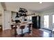 Modern kitchen with white cabinets, black appliances, wood island, and stylish counter seating at 841 E Zion Church Rd, Shelby, NC 28150