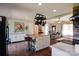 Spacious kitchen with a large island, pot rack, white cabinets, and hardwood floors at 841 E Zion Church Rd, Shelby, NC 28150