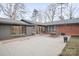 Spacious backyard featuring a concrete patio ideal for outdoor entertaining with mature trees at 845 2Nd Nw St, Hickory, NC 28601