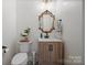 Bathroom featuring a decorative mirror, modern vanity, and tiled floors at 845 2Nd Nw St, Hickory, NC 28601