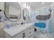 Bathroom featuring double sinks, white marble counters and unique shower curtain adding character at 845 2Nd Nw St, Hickory, NC 28601