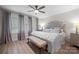 Elegant bedroom featuring a tufted headboard, soft lighting, and a cozy bench at 845 2Nd Nw St, Hickory, NC 28601