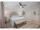 Inviting bedroom with a plush upholstered bed, soft lighting and neutral decor at 845 2Nd Nw St, Hickory, NC 28601