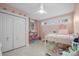 Bright bedroom with a white loft bed, plush pink accents and ample storage in a lovely setting at 845 2Nd Nw St, Hickory, NC 28601