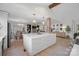 Open-concept kitchen with a large island, stainless steel appliances, and modern lighting, perfect for cooking and entertaining at 845 2Nd Nw St, Hickory, NC 28601