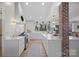 Bright, modern kitchen with an expansive island, state-of-the-art appliances, and a unique brick pillar, ideal for culinary enthusiasts at 845 2Nd Nw St, Hickory, NC 28601