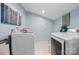 Laundry room with new machines and custom wall decor at 845 2Nd Nw St, Hickory, NC 28601