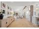 Bright, open-concept living area flowing into a modern kitchen, showcasing stylish decor and ample natural light at 845 2Nd Nw St, Hickory, NC 28601