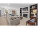 Bright living room features a cozy fireplace, built-in shelving, and neutral tones, creating an inviting and stylish atmosphere at 845 2Nd Nw St, Hickory, NC 28601