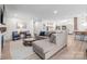 Spacious living room with a sectional sofa, wood floors, and ample seating, designed for comfort and style at 845 2Nd Nw St, Hickory, NC 28601