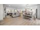 Open-concept living space with wood floors, neutral colors, and plenty of natural light, ideal for modern living at 845 2Nd Nw St, Hickory, NC 28601