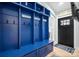 Charming mudroom offers blue built-in storage with hooks and bench seating at 845 2Nd Nw St, Hickory, NC 28601