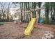 Backyard playground with swings and slide set, providing outdoor fun at 845 2Nd Nw St, Hickory, NC 28601