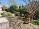Inviting backyard featuring mature trees, decorative planters, and lush landscaping at 86614 Arrington Rd, Lancaster, SC 29720