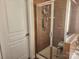 Bathroom showcasing a glass shower with tiled walls and a storage rack at 86614 Arrington Rd, Lancaster, SC 29720