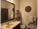 Bathroom featuring a vanity with a sink, mirror, decorative shelves and a toilet at 86614 Arrington Rd, Lancaster, SC 29720