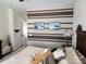 Bedroom featuring horizontal brown stripes and two lake landscape pictures adorning the wall at 86614 Arrington Rd, Lancaster, SC 29720