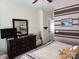Comfortable bedroom featuring a dresser, mirror, and decorative brown-striped accent wall at 86614 Arrington Rd, Lancaster, SC 29720